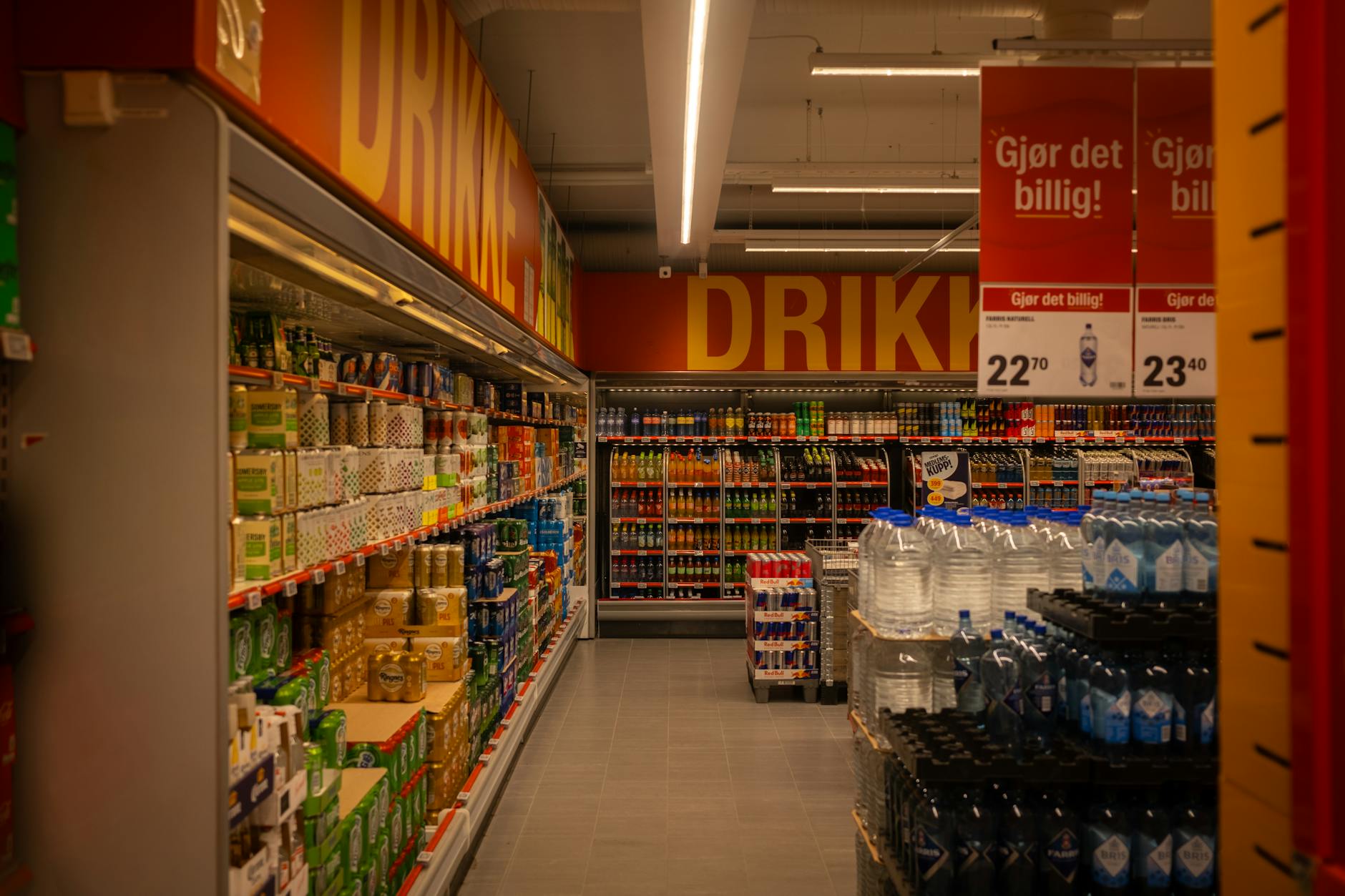 Modern supermarket interior with shopping carts and product aisles