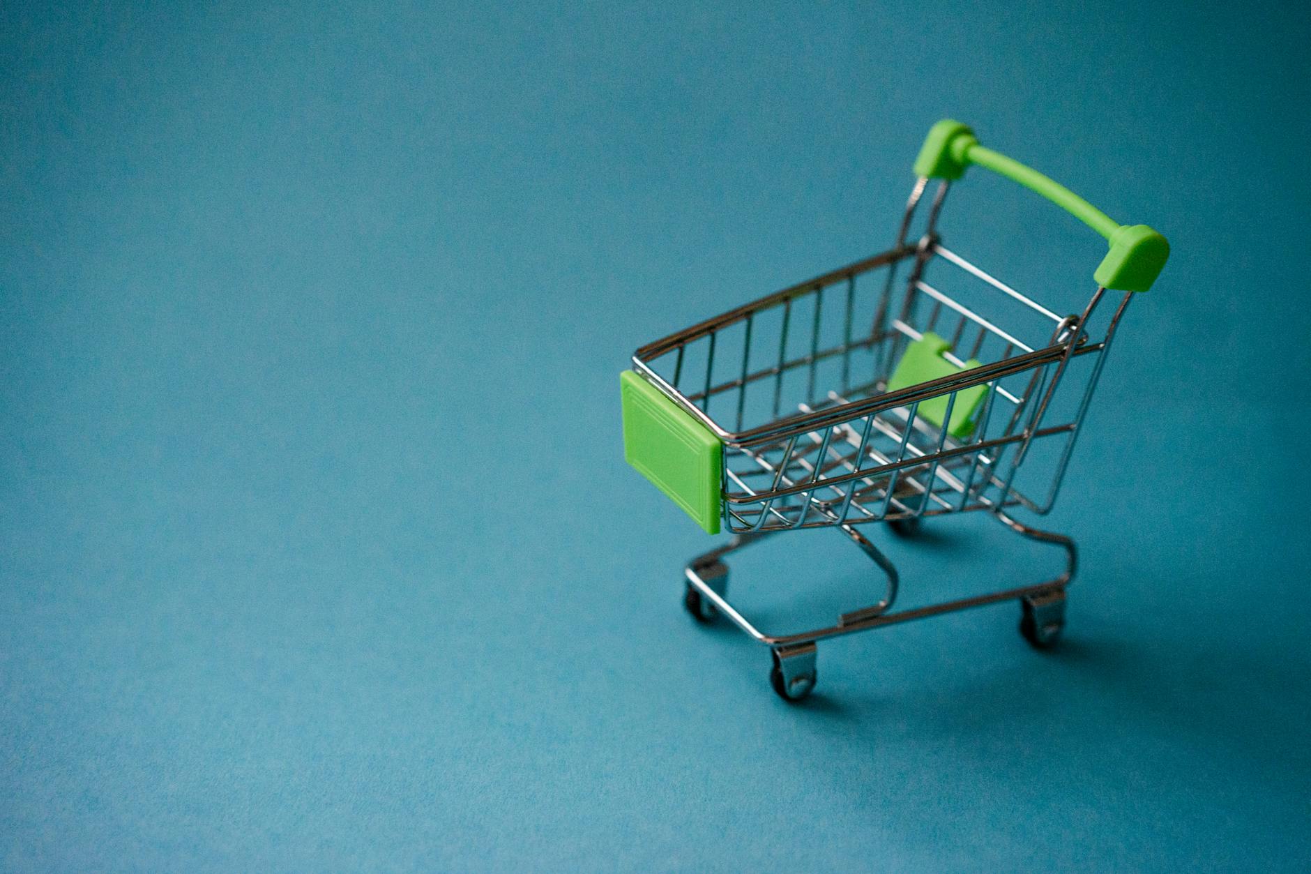 Shopping cart filled with various consumer products representing retail purchasing decisions