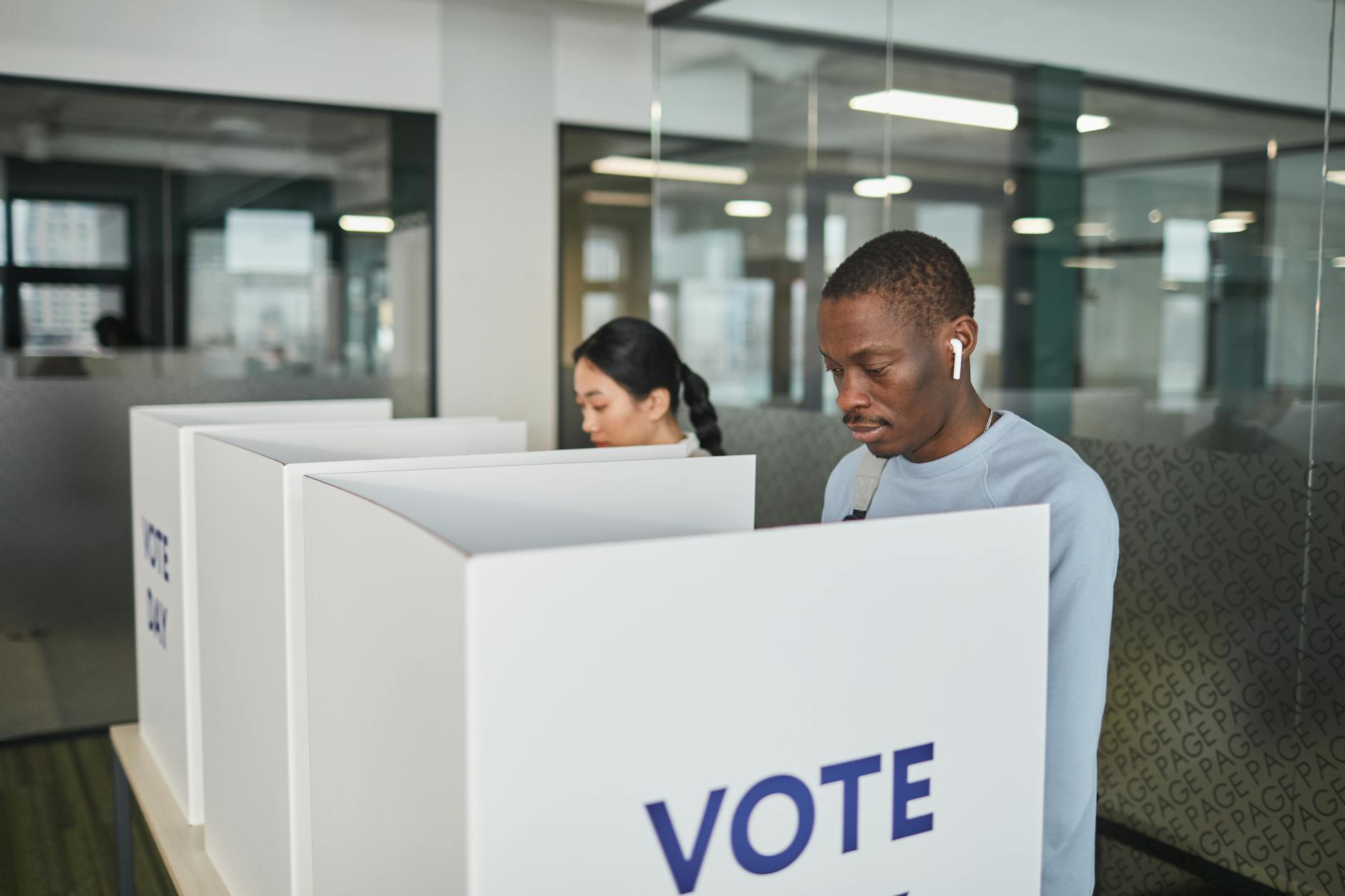Voting booth interior representing democratic participation and electoral implications of migration