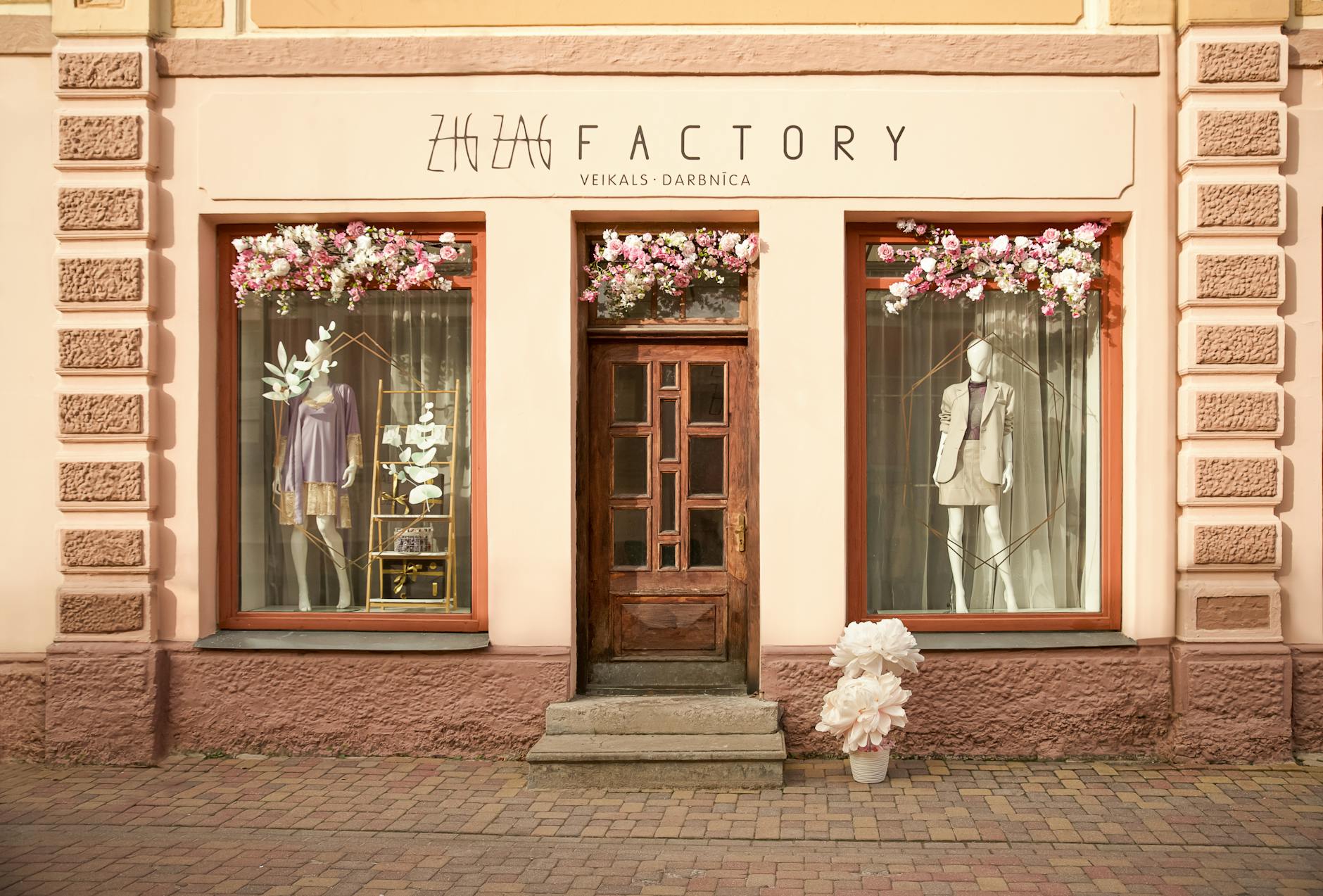 Attractive storefront with window display showcasing retail merchandise and branding