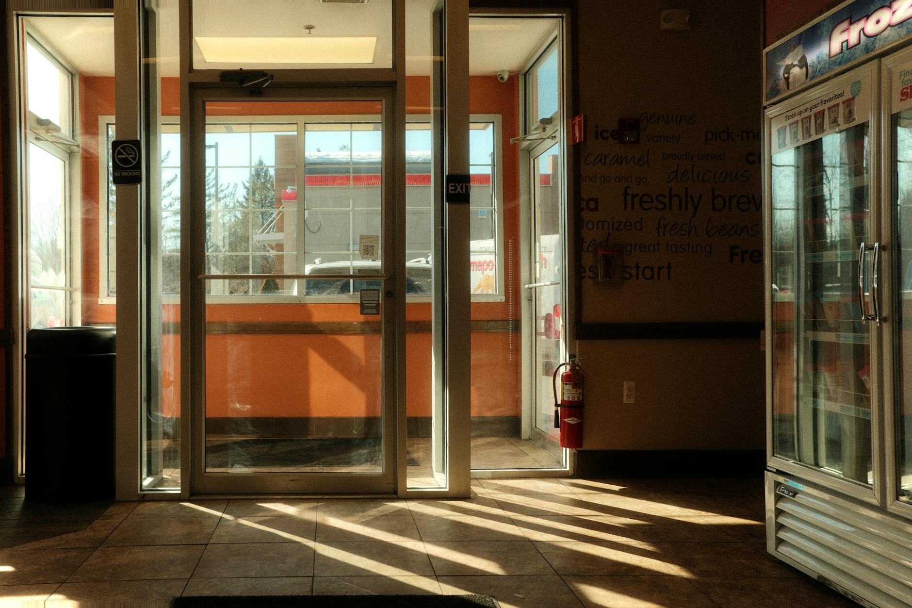 Interior view of convenience store with shelves and checkout counter