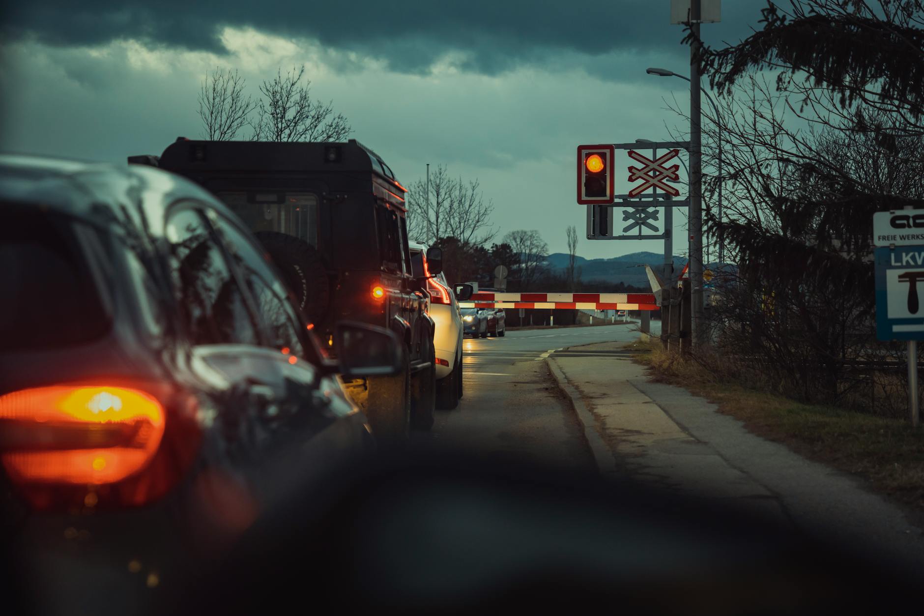 Line of cars waiting in a drive-thru queue during busy hours