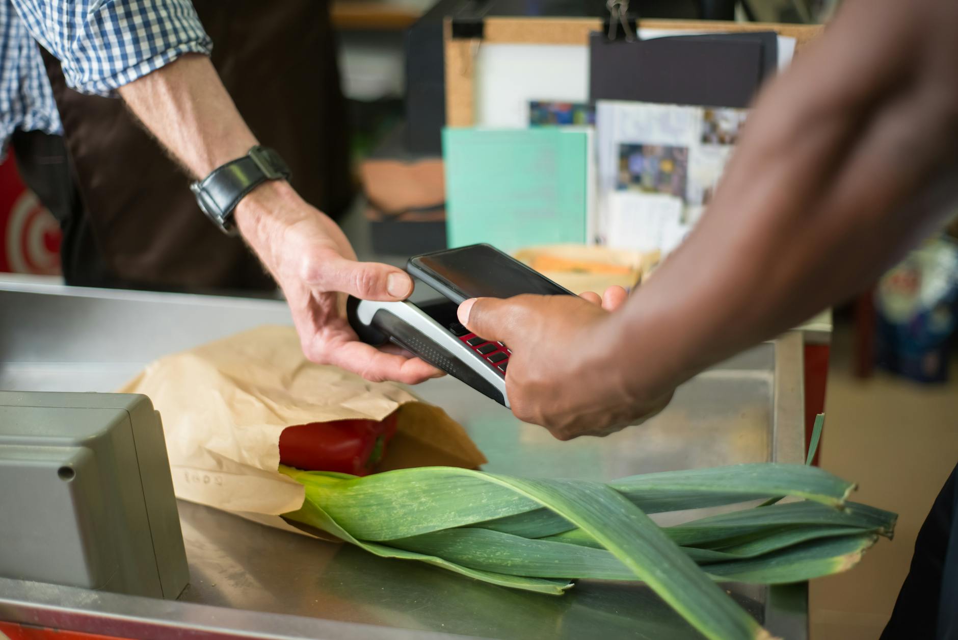 Modern retail checkout counter with digital payment options displayed