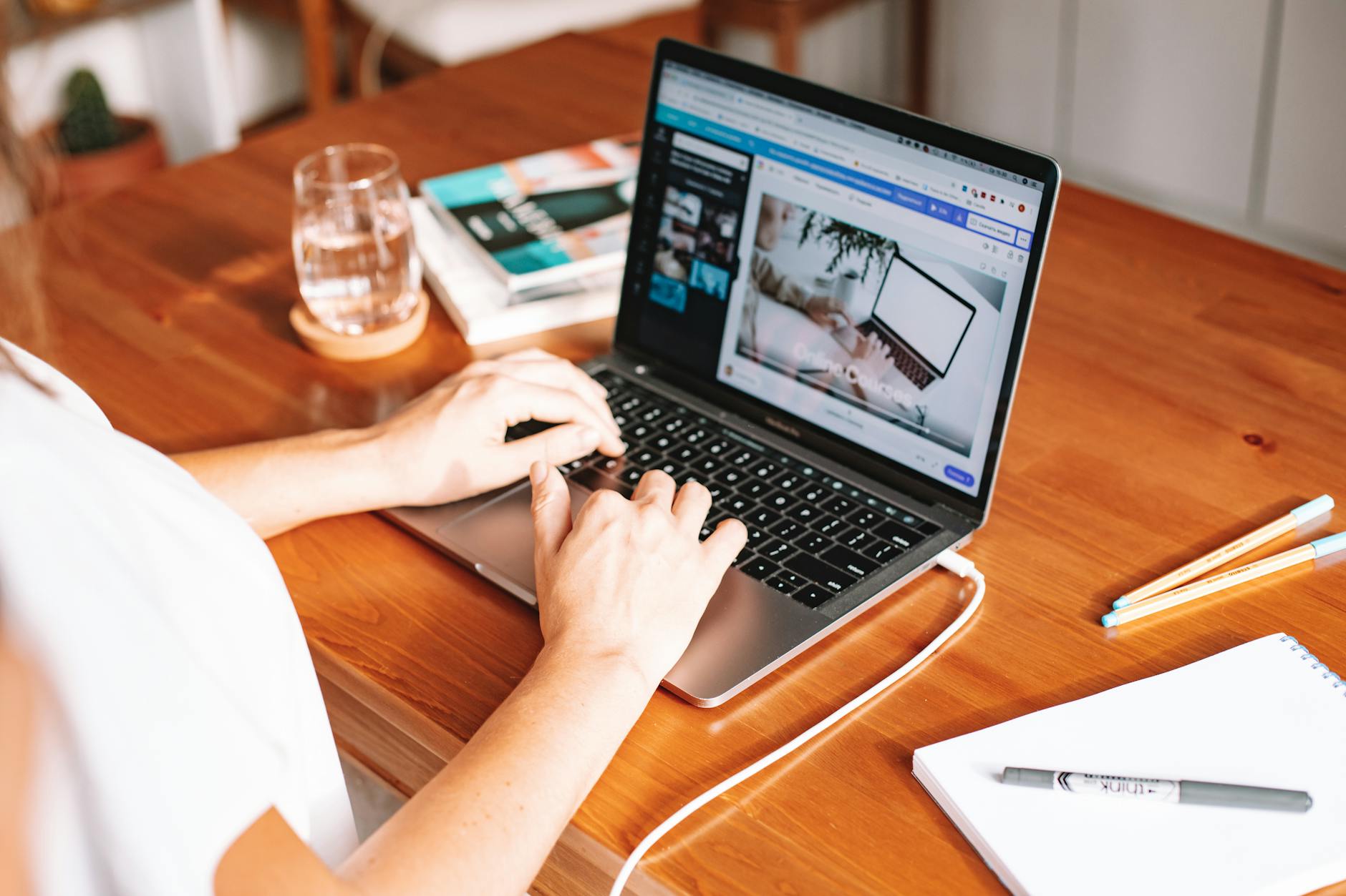 Home office setup with laptop and desk representing hybrid work arrangements and productivity flexibility
