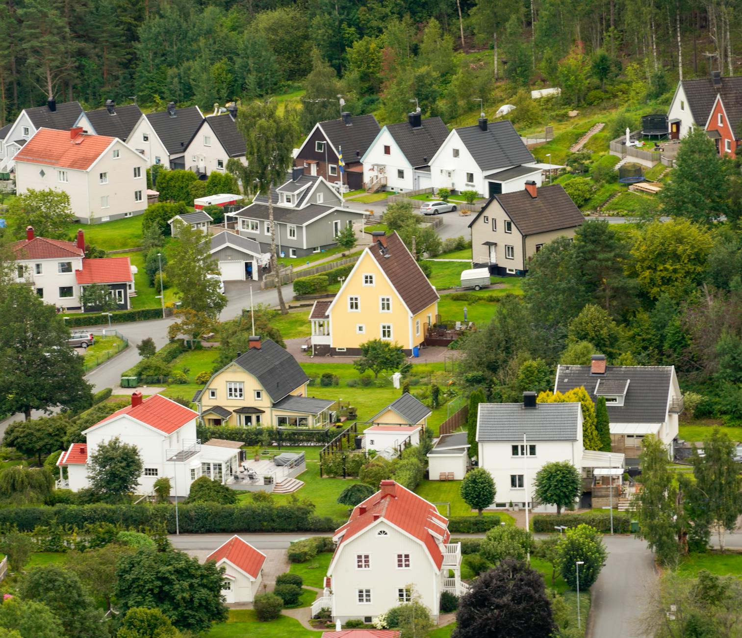 Quiet suburban neighborhood with houses and tree-lined streets inland from coast
