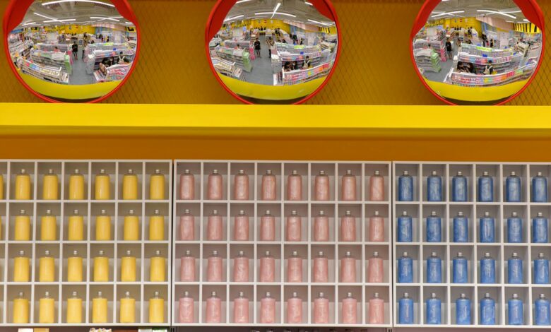 Wide interior view of a warehouse-style retail store with high shelving and bulk products