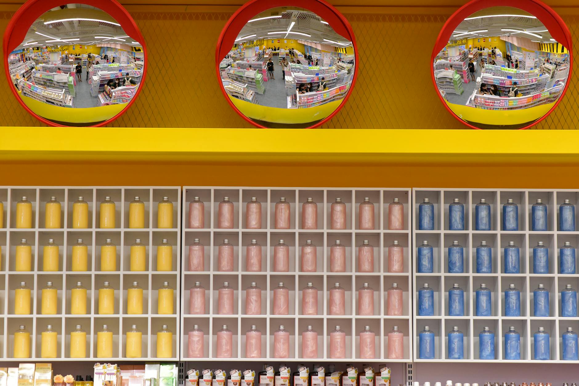 Wide interior view of a warehouse-style retail store with high shelving and bulk products