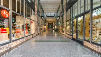 Empty mall interior with vacant storefronts and minimal foot traffic