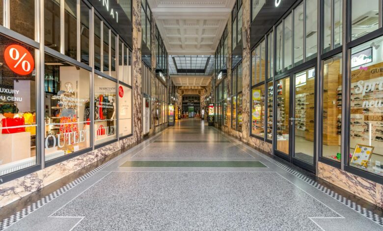 Empty mall interior with vacant storefronts and minimal foot traffic