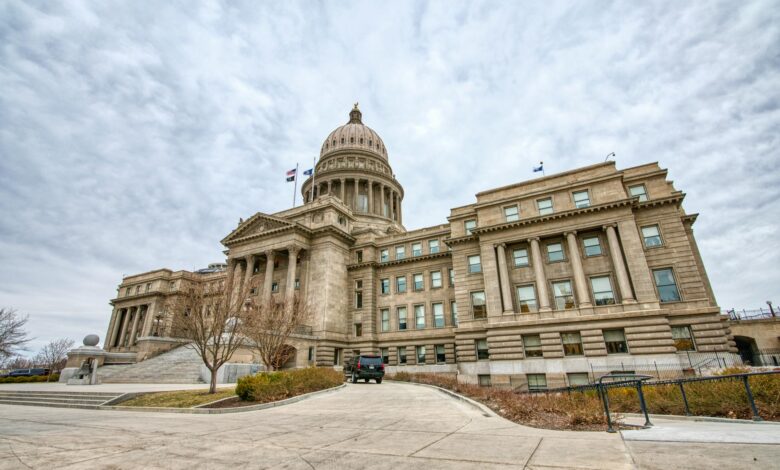 State government building with American flag representing gubernatorial leadership