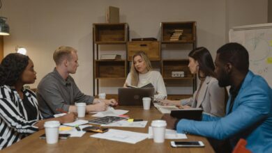 Professional business meeting in modern office setting with people collaborating