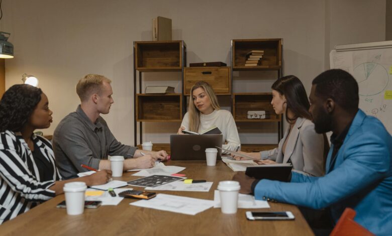 Professional business meeting in modern office setting with people collaborating