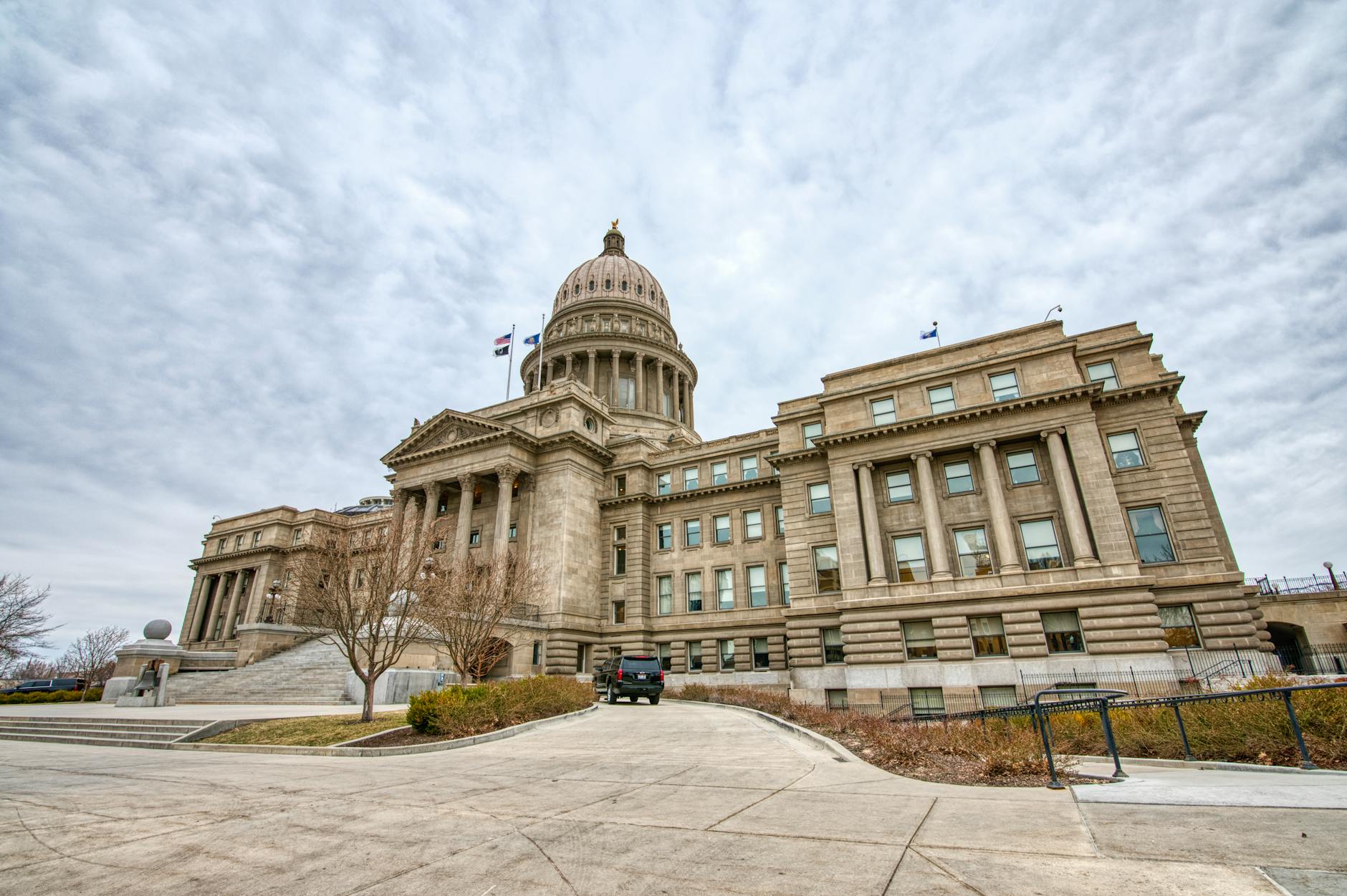 State government building with American flag representing gubernatorial leadership