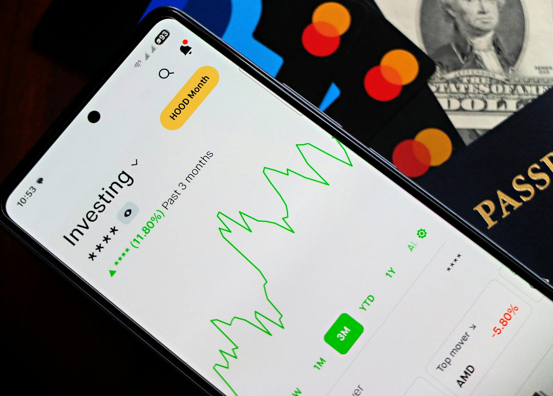 Person using a smartphone to manage investment accounts through a brokerage app