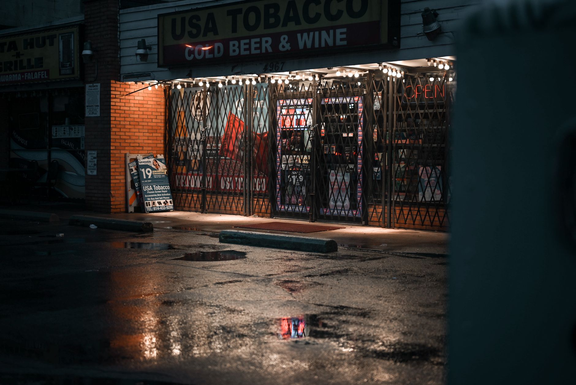 Vacant retail storefront on an urban city street with empty display windows