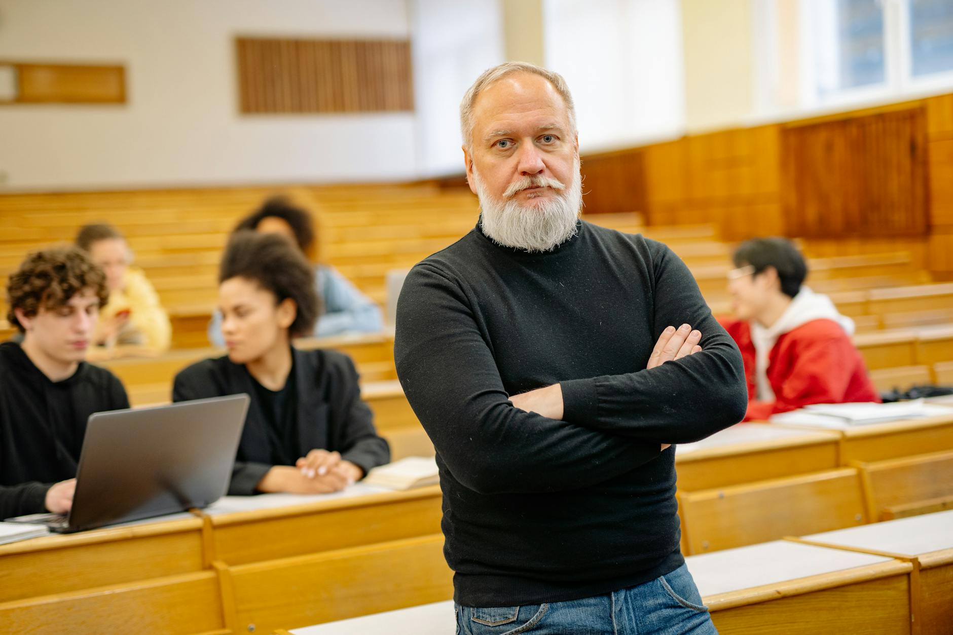 Adult students sitting in classroom listening to instructor