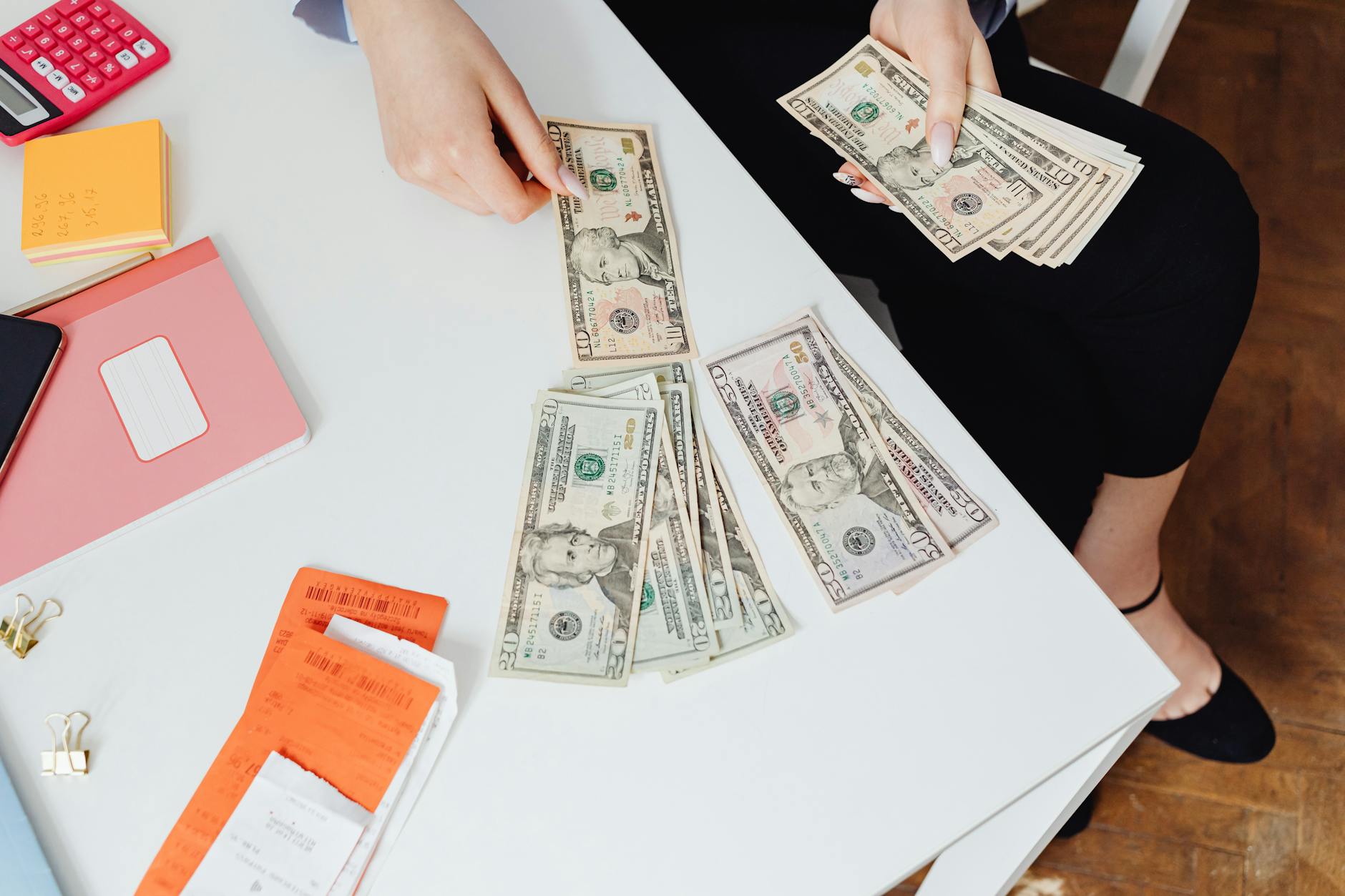 Hands counting cash bills representing campaign fundraising success