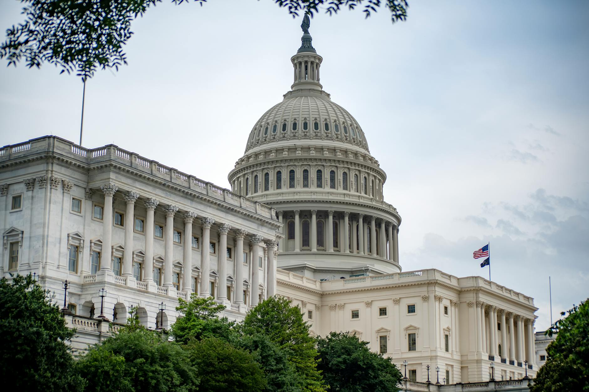 United States Capitol building exterior with cloudy sky overhead