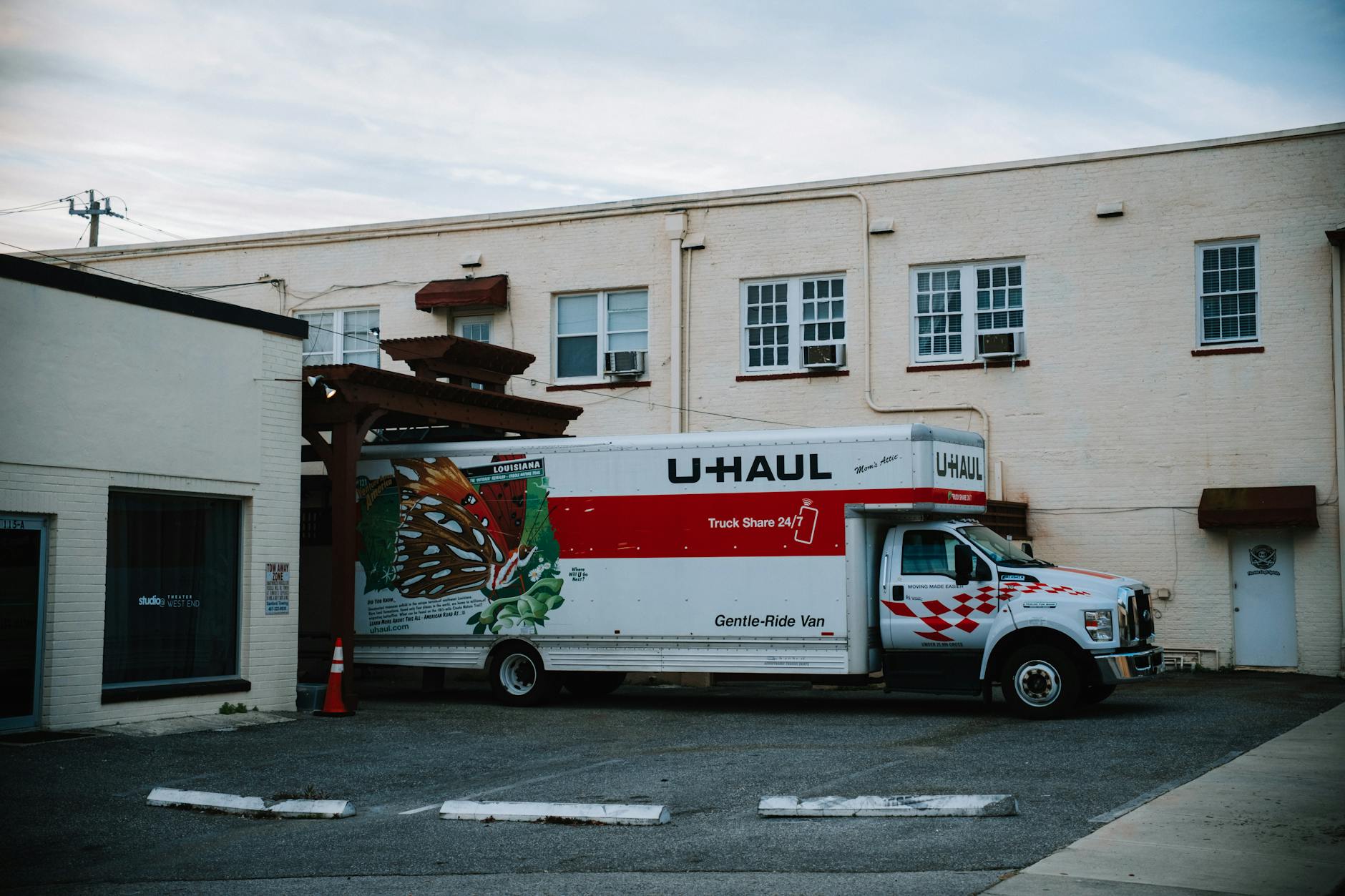 Delivery truck parked on a city street outside a food distribution center