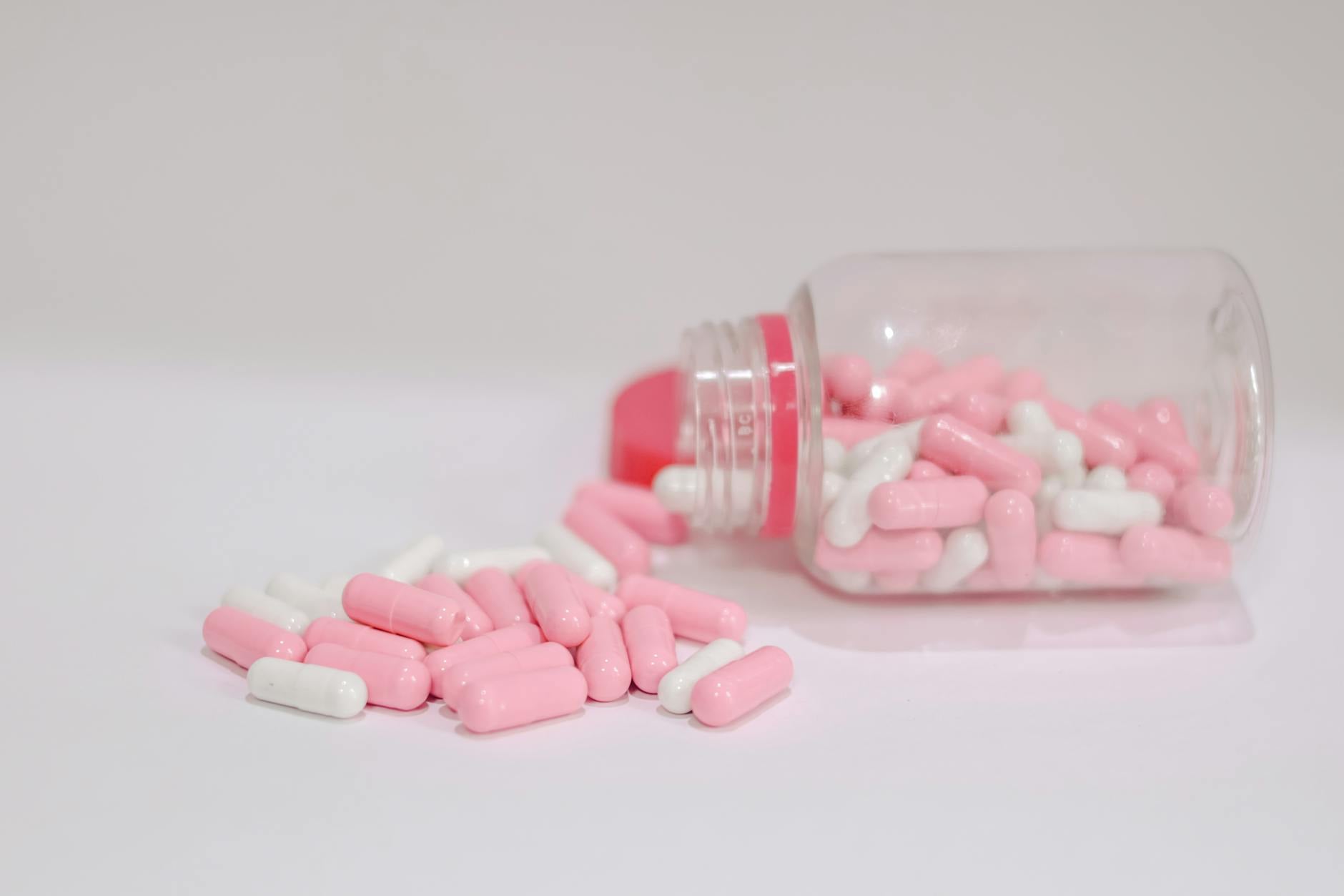 Various prescription drug bottles representing specialty pharmaceutical supply chain management