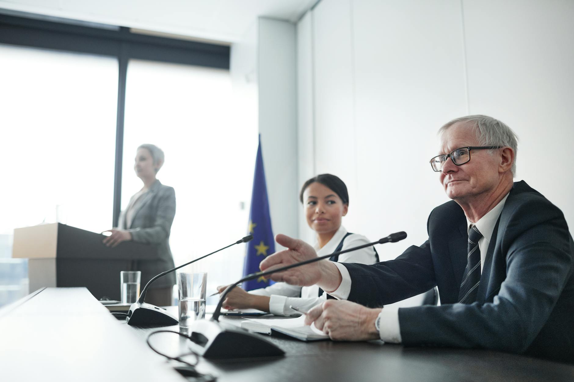 Political strategists discussing campaign plans around conference table