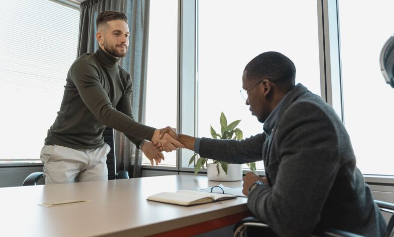 A staffing agency office with a recruiter reviewing candidate files at a desk