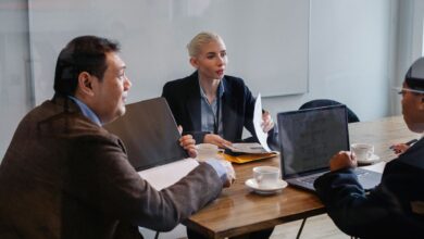 Creative professionals gathered around a conference table in an advertising agency office