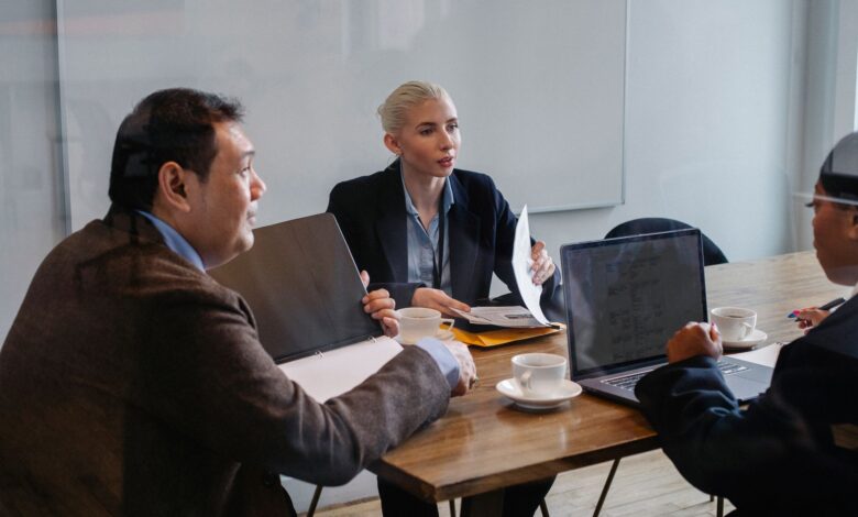Business professionals in a corporate meeting room discussing strategy