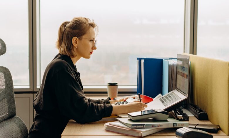 Accountants working at desks in a modern office environment