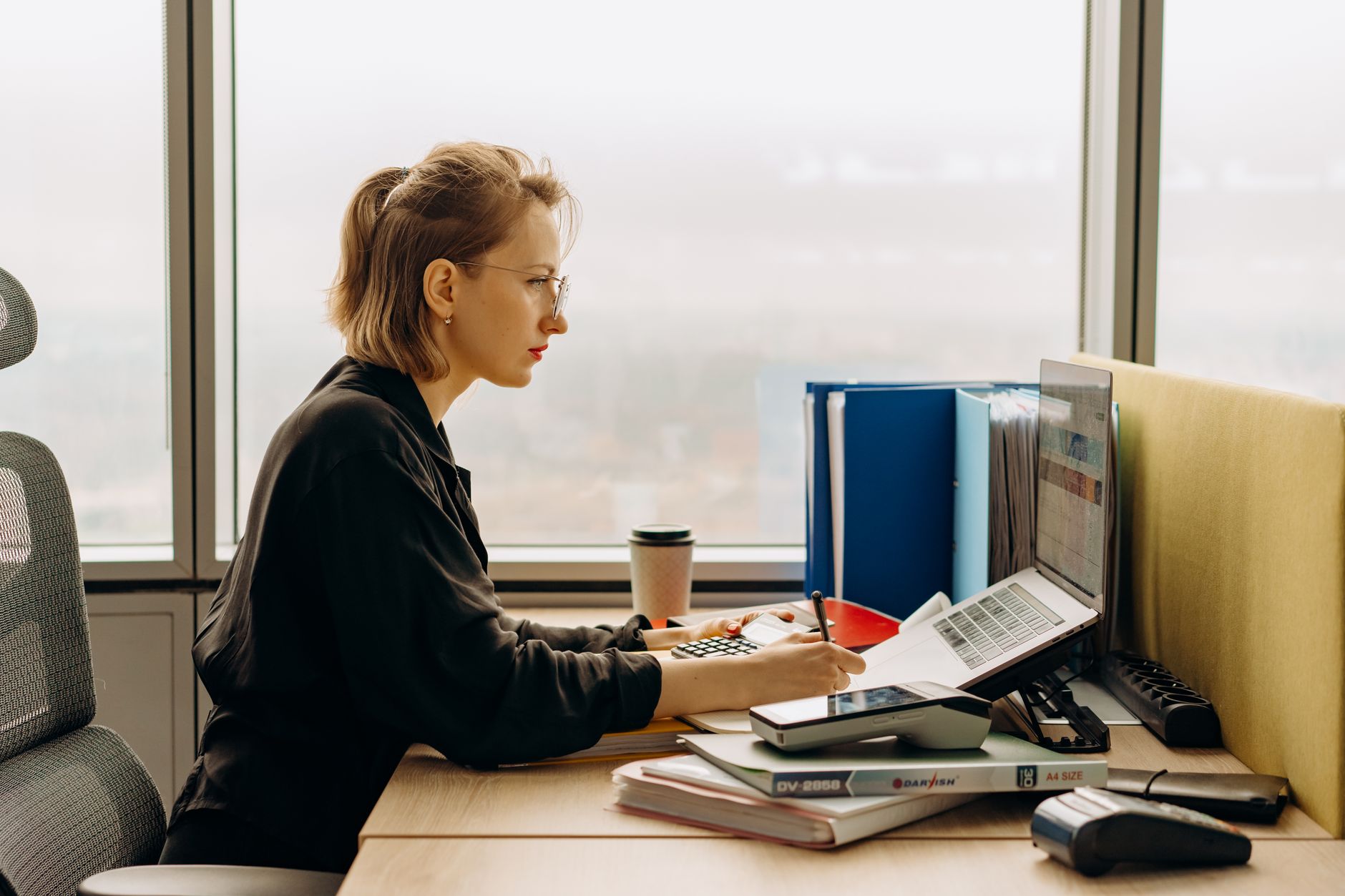 Accountants working at desks in a modern office environment