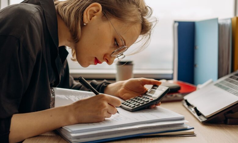 Accountant reviewing financial documents at an office desk