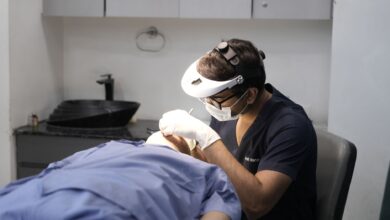 A clean, modern dermatology clinic waiting room with medical equipment visible