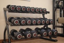 Empty fitness studio interior with exercise equipment and open floor space