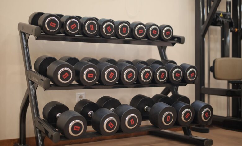 Empty fitness studio interior with exercise equipment and open floor space