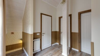 Empty hallway inside a skilled nursing facility with medical equipment along the walls