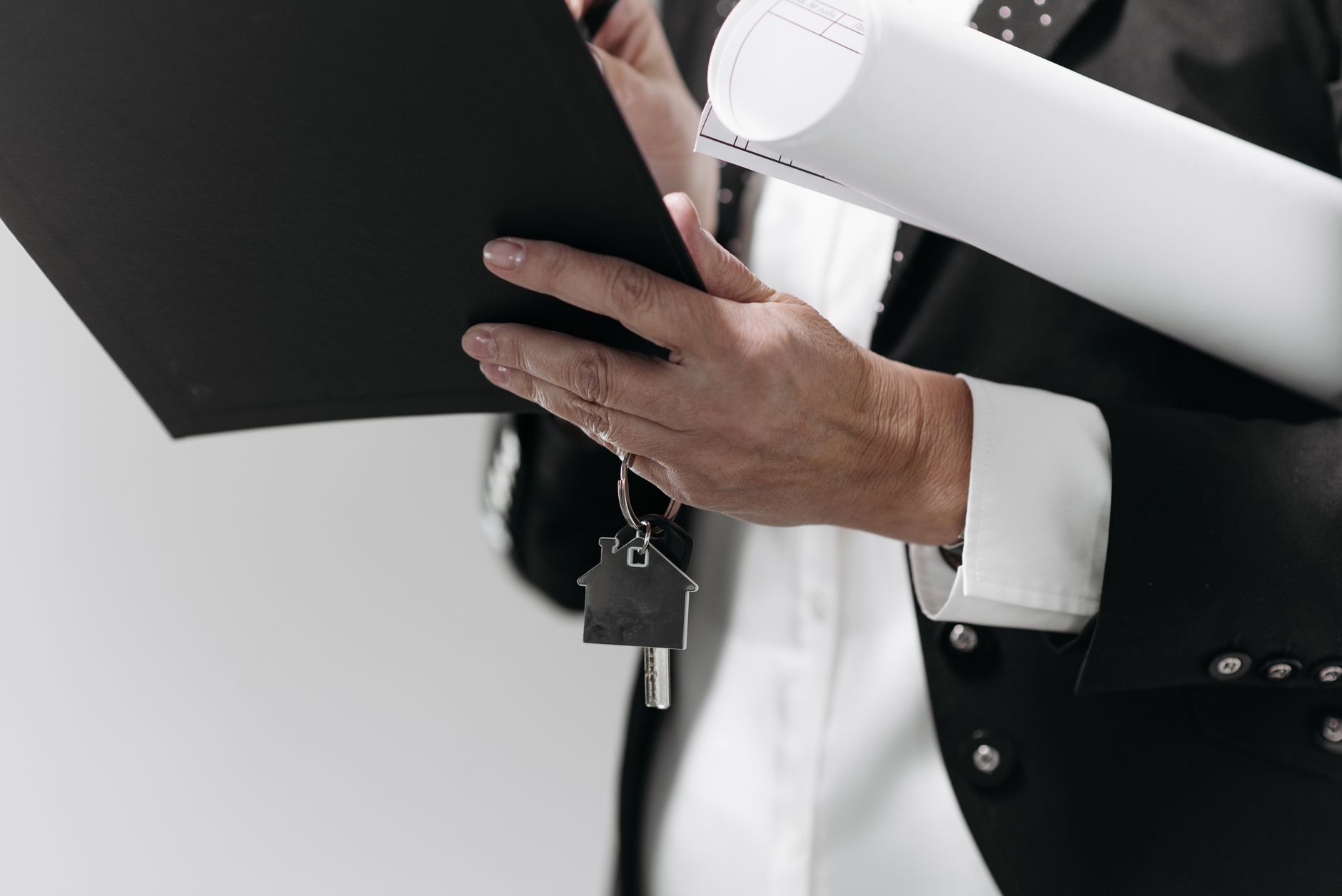 Mortgage documents and financial paperwork spread across a desk