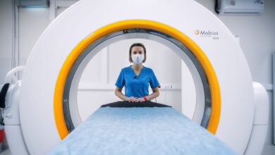 Radiologist reviewing medical scans on a digital workstation in a clinical setting