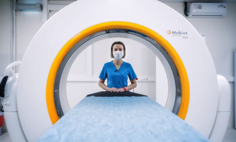 Radiologist reviewing medical scans on a digital workstation in a clinical setting