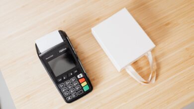 A retail payment terminal sitting on a store counter representing merchant payment processing