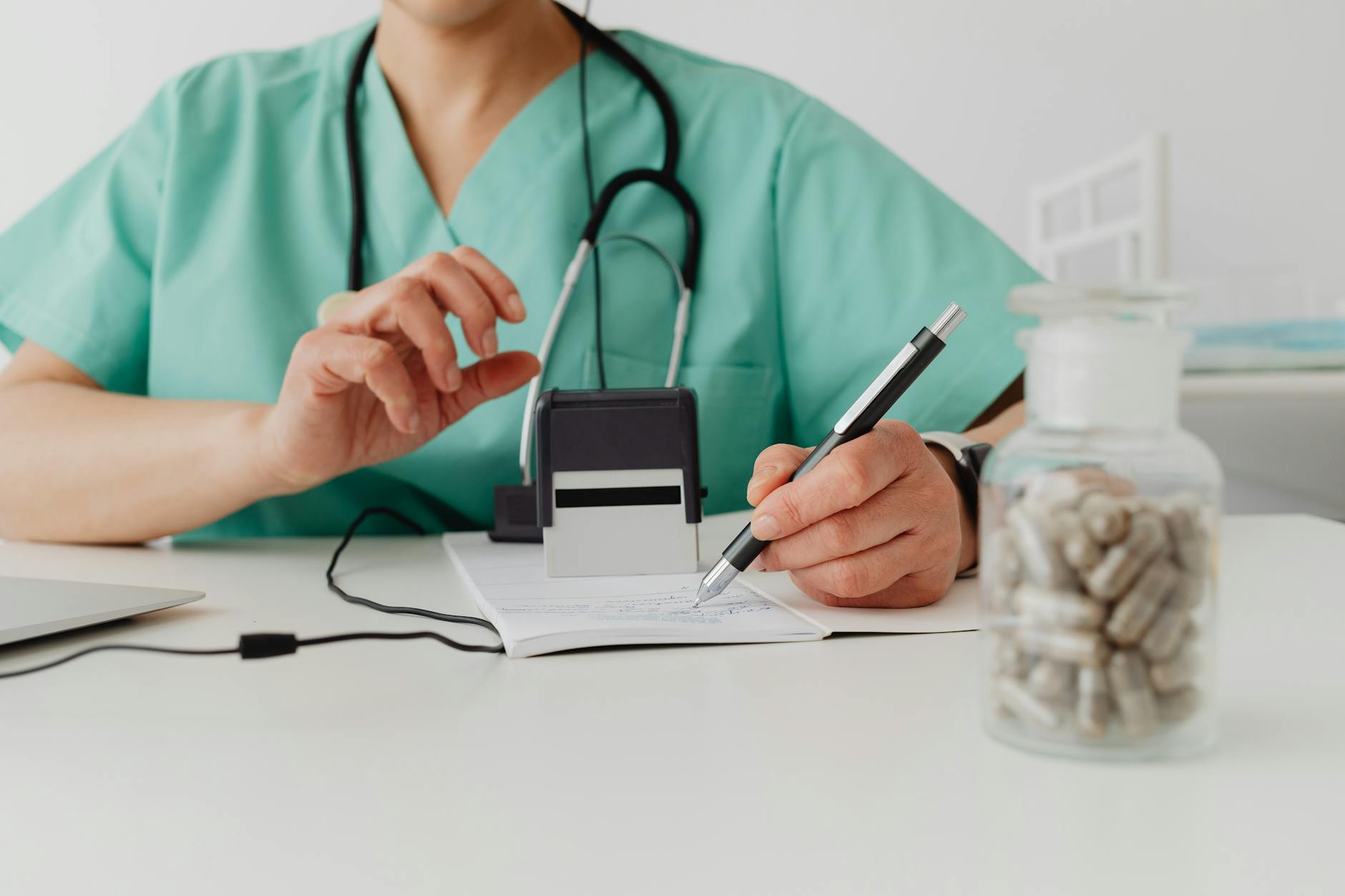 Healthcare provider reviewing medication information with a patient during a clinical consultation