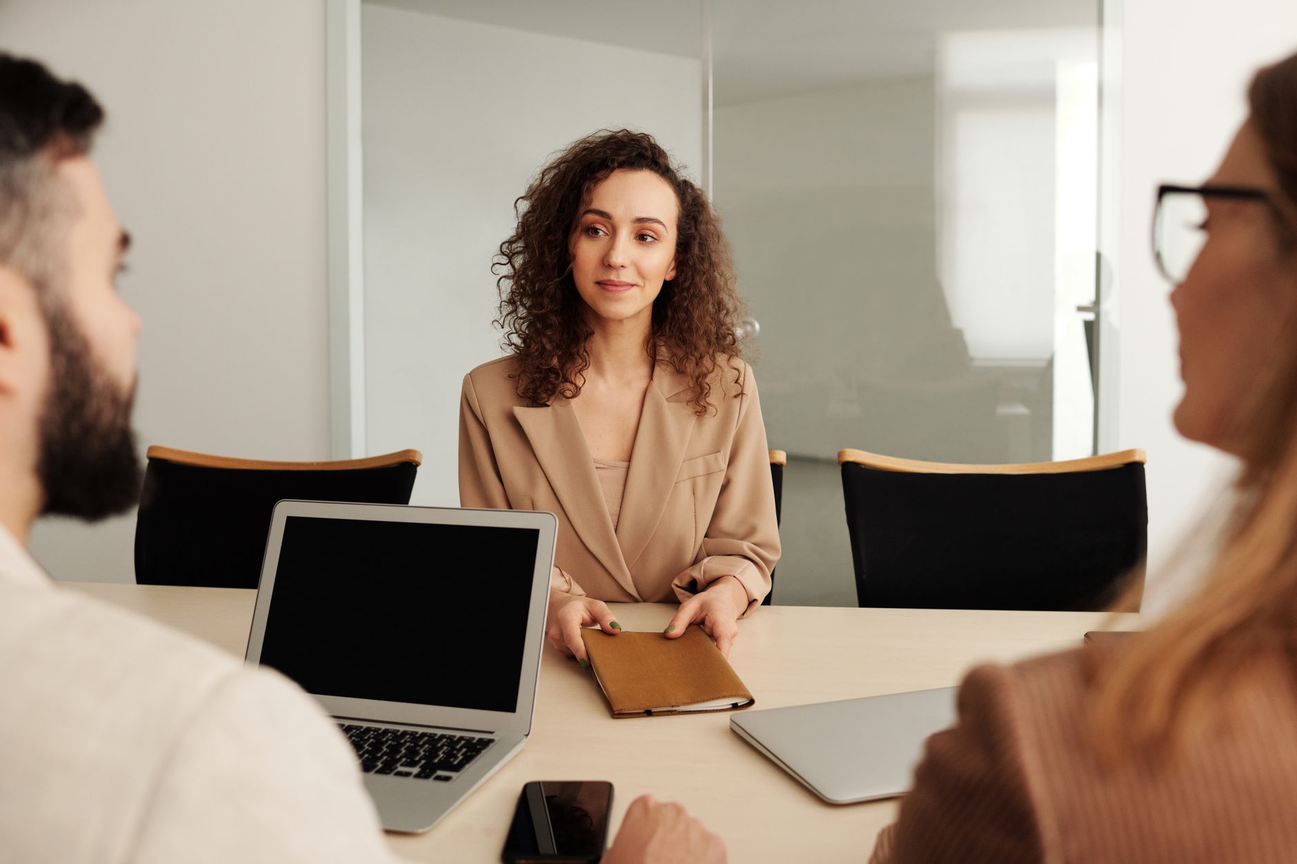Professional job interview taking place in a modern office setting