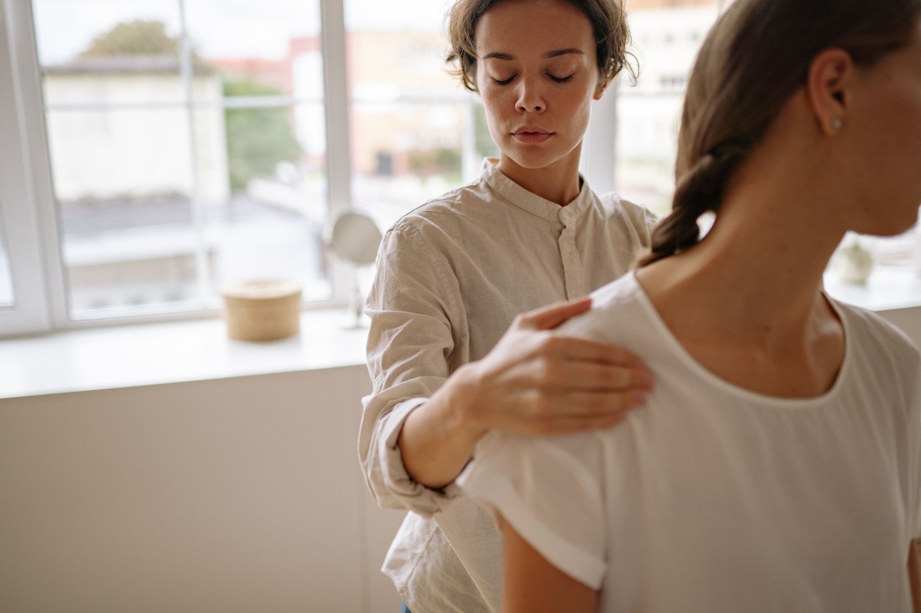Physical therapist working with a patient on rehabilitation exercises in a clinic setting