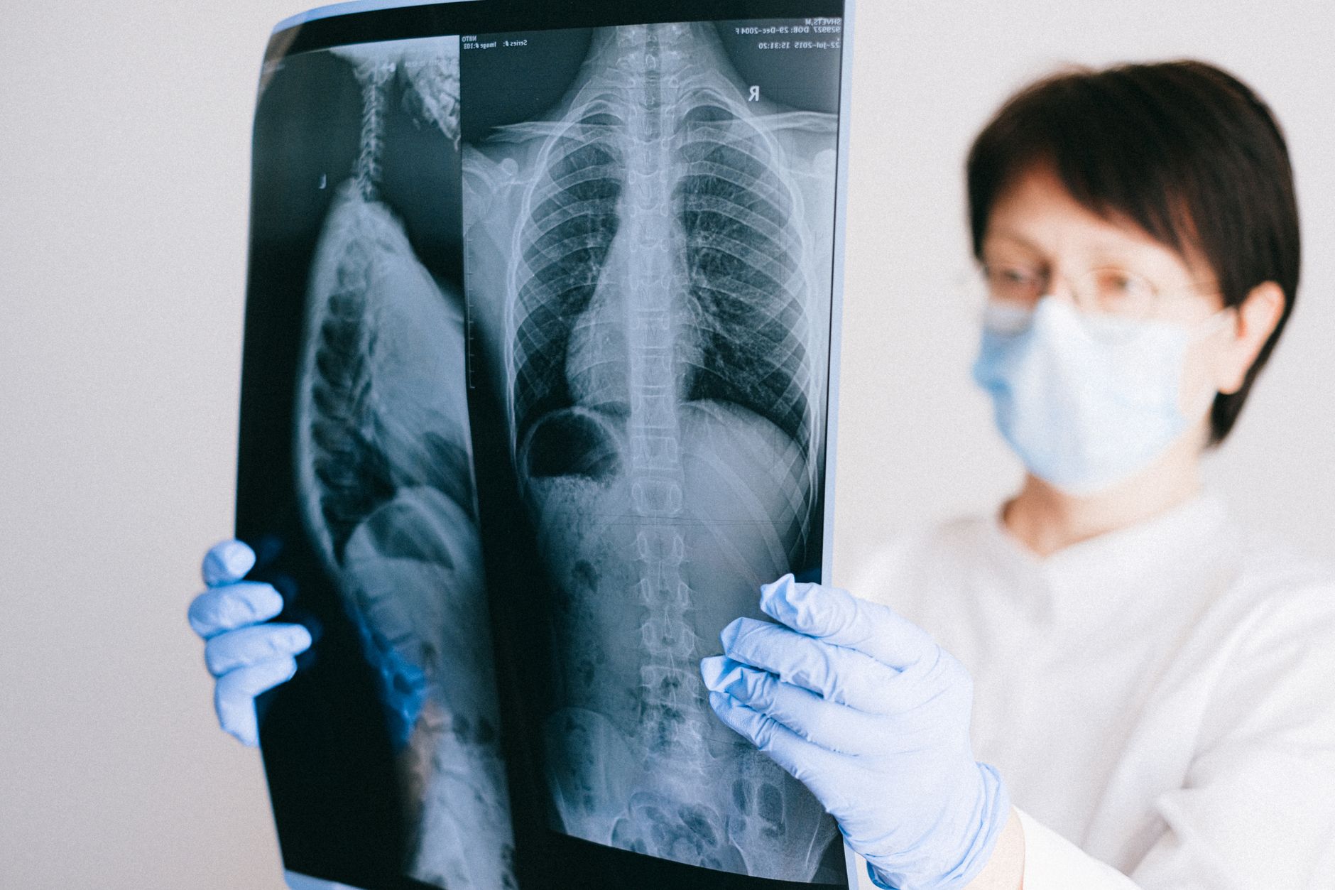 Medical professional analyzing diagnostic imaging scans on multiple monitors