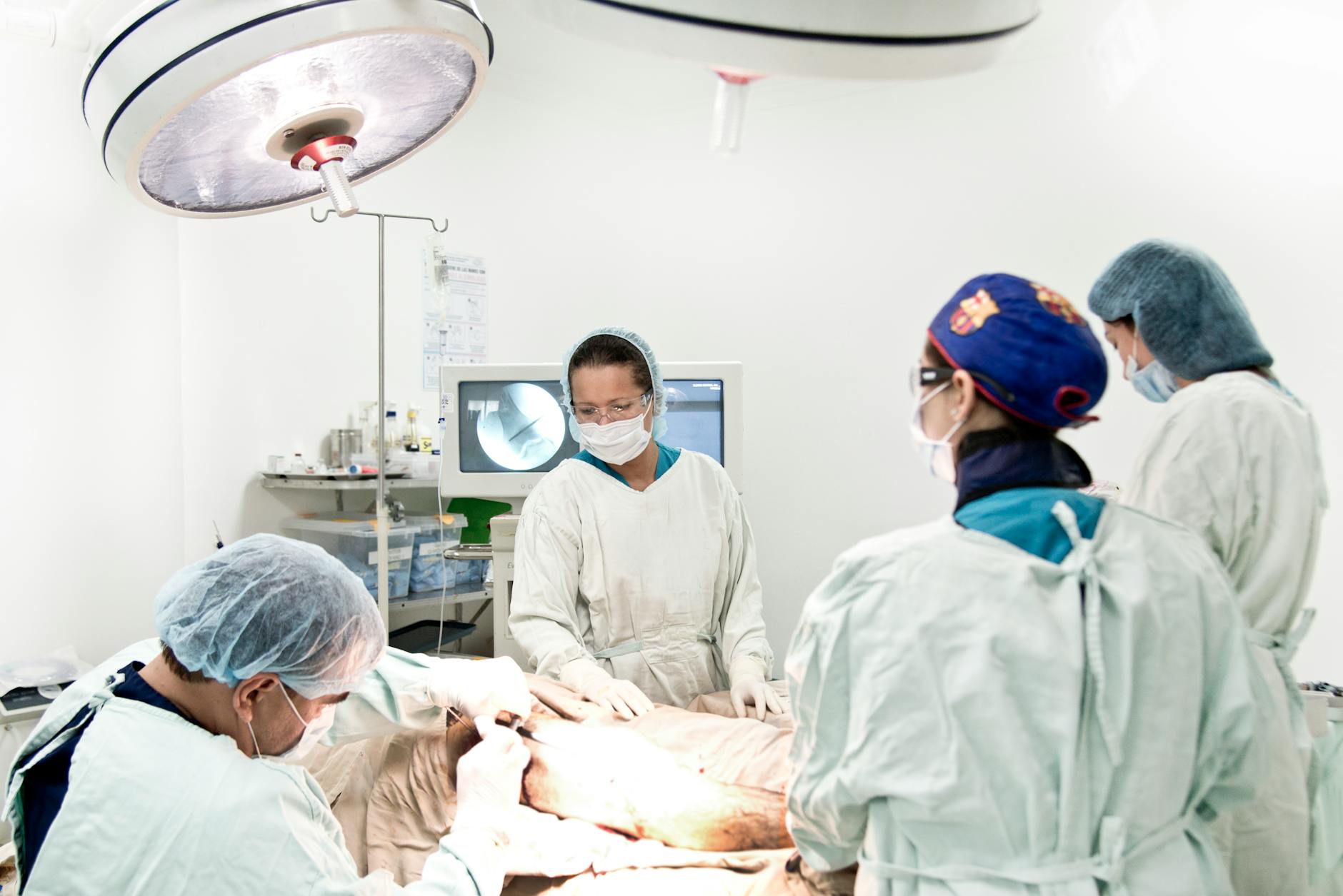Surgical team performing an outpatient procedure in a modern operating room
