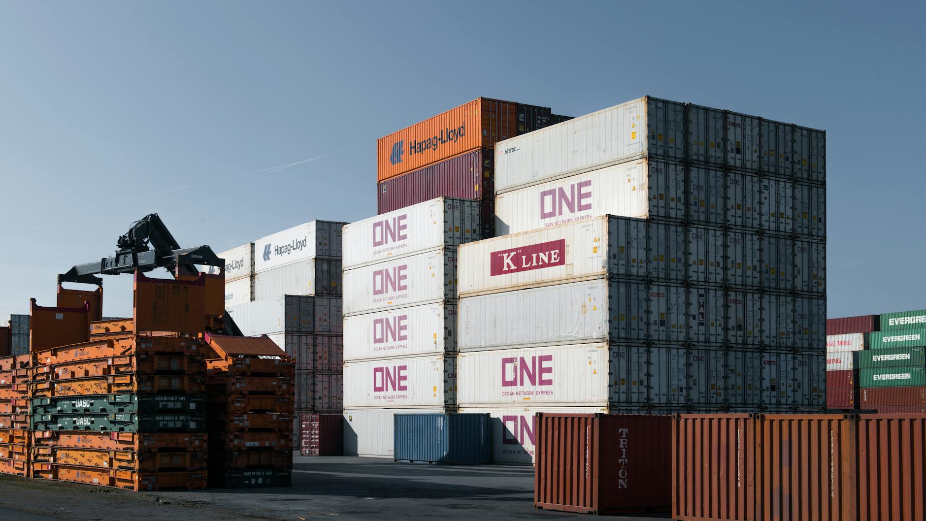 Rows of stacked intermodal shipping containers at a rail freight yard