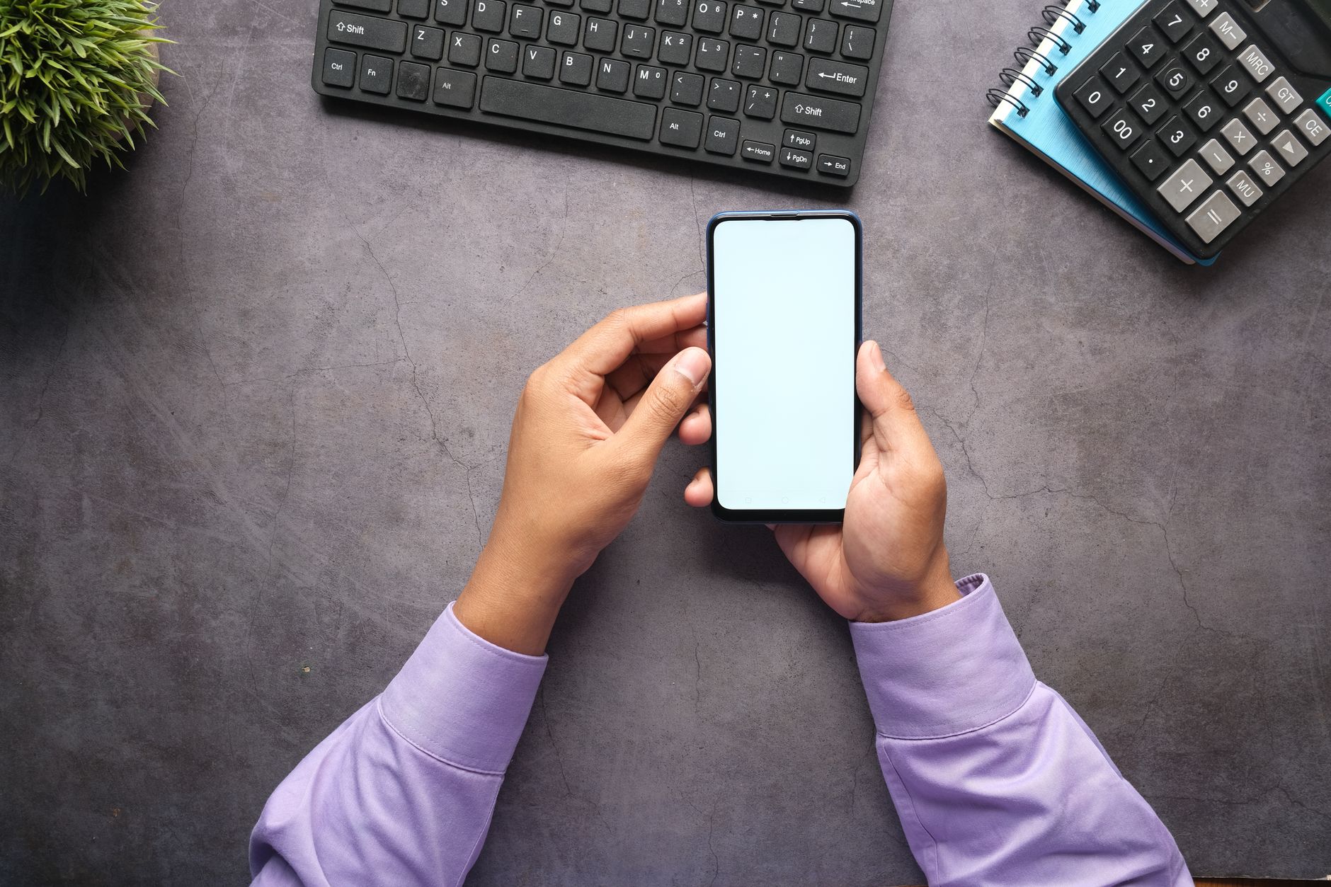 Person using a smartphone app to manage work shift scheduling