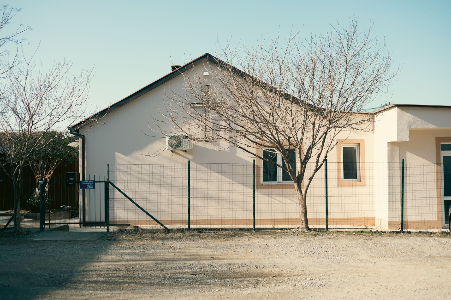 Exterior of a small rural healthcare clinic on a quiet street
