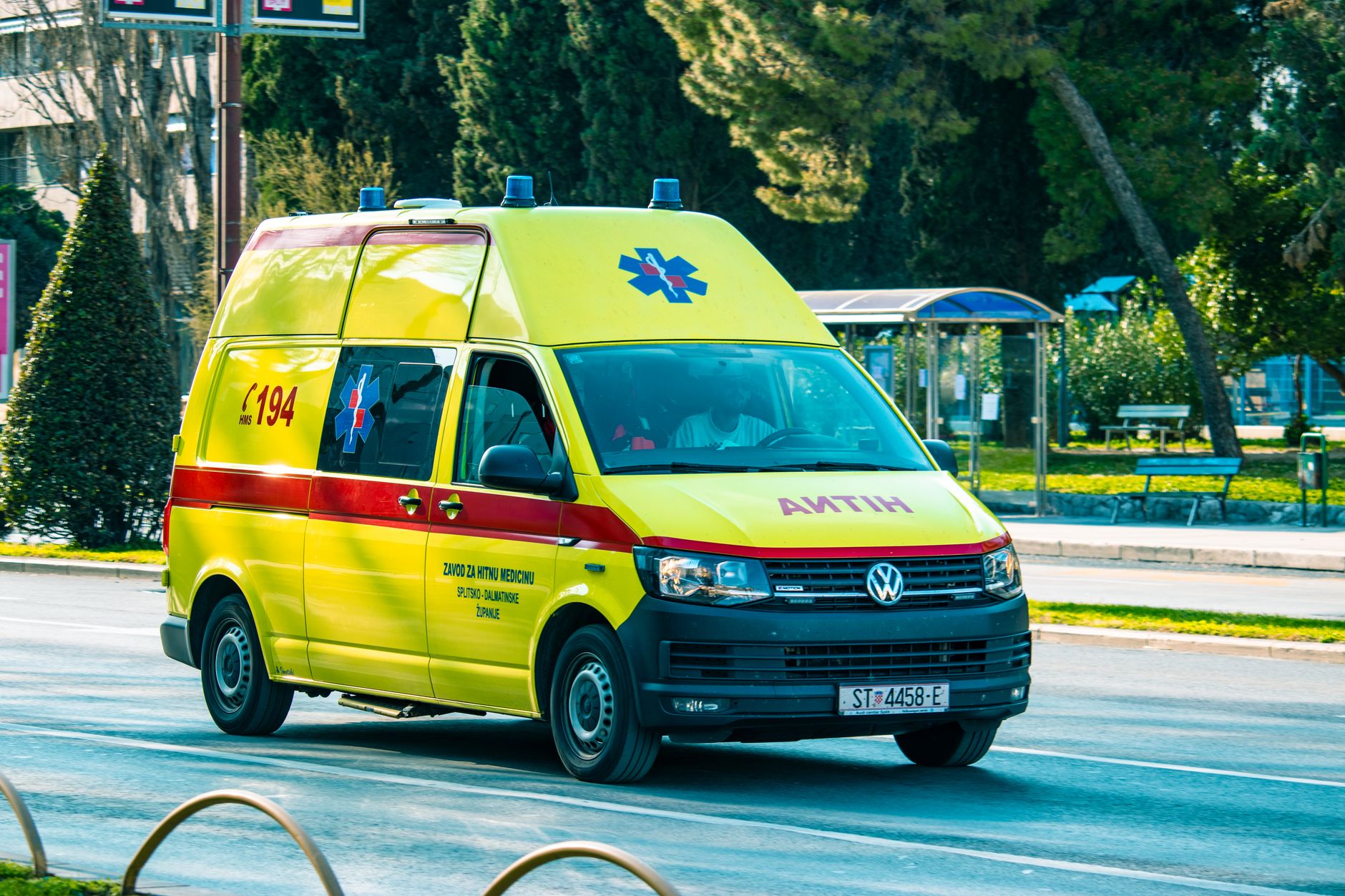 An ambulance parked outside a medical facility representing ground transport services