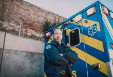 An ambulance parked on a city street representing ground transport emergency services
