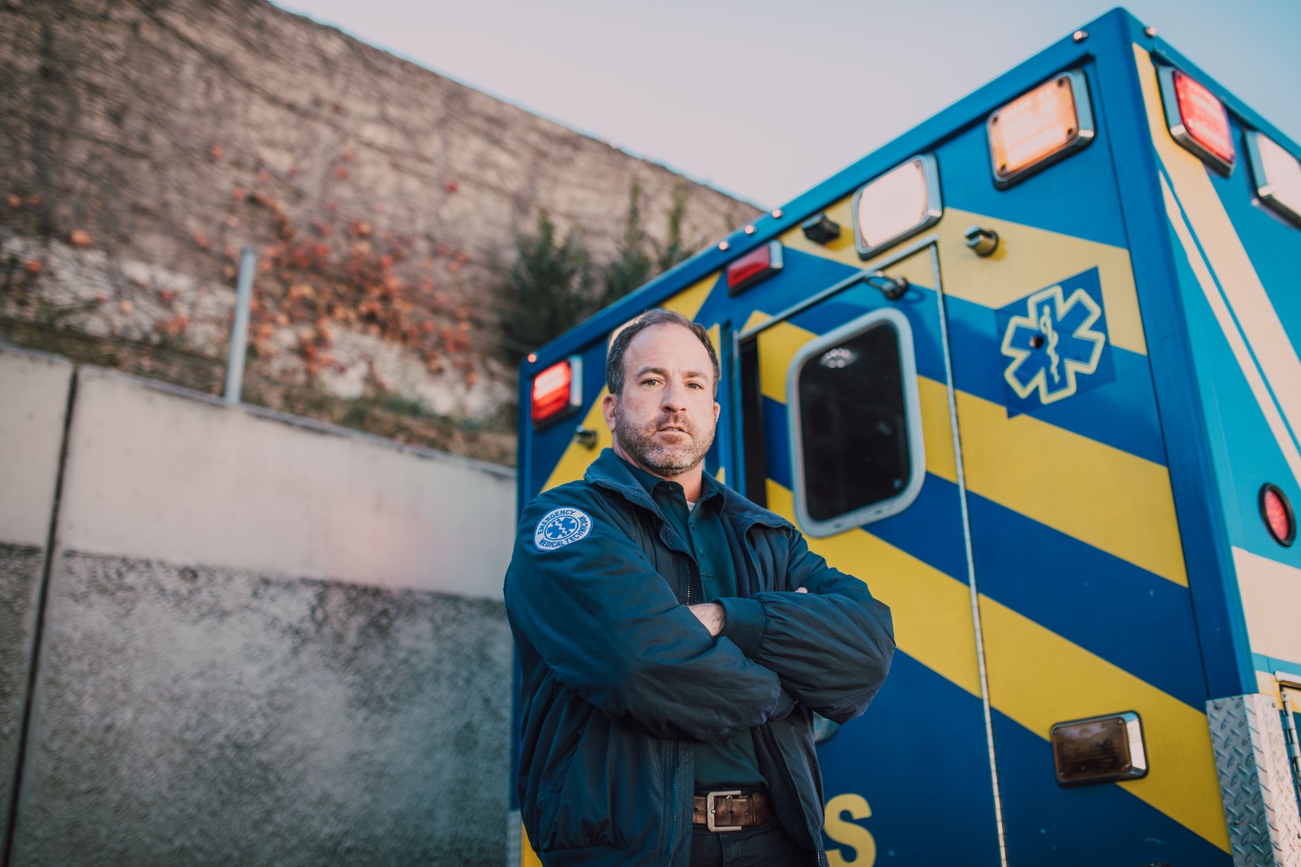 An ambulance parked on a city street representing ground transport emergency services